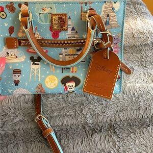 Dooney & Bourke Light Blue Disney Print Satchel with Brown Trim